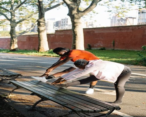 man stretching morning park healthy routine